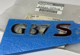 84894ju40b Infiniti 2009-2013 G37 Trunk Emblem Lid Nameplate Oem
